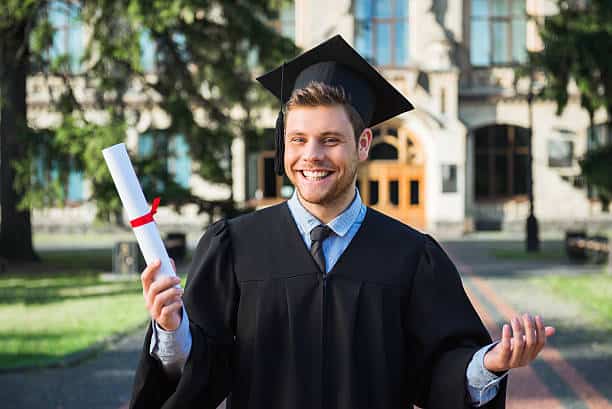 PMI certification graduate holding diploma and celebrating success.