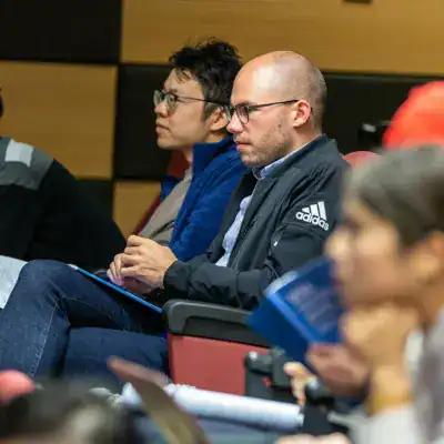 Professionals attending a global IT certification seminar at Prime Technologies.