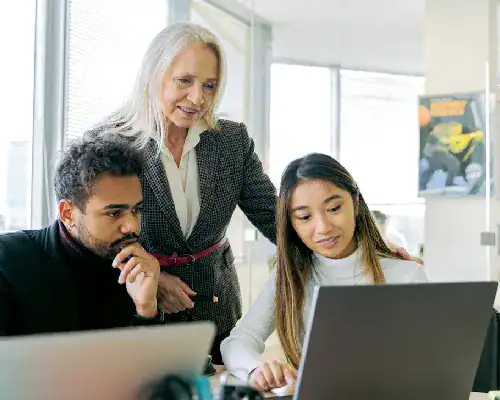 Experienced instructor guiding students in IT certification training.