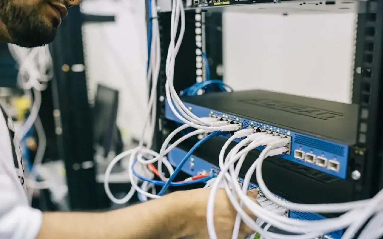 Graphic showing network devices leading to career advancement symbols, with the Cisco and Prime Technologies logos.
