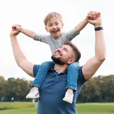 Father and son enjoying outdoor time, symbolizing teamwork and collaboration.