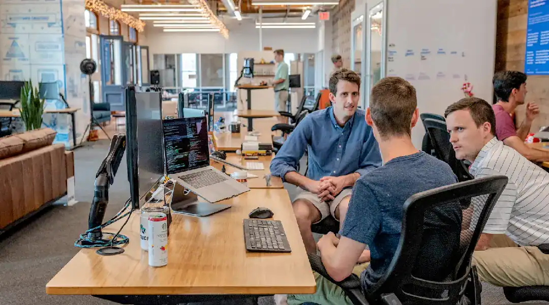 Cybersecurity professionals collaborating in a modern office environment.