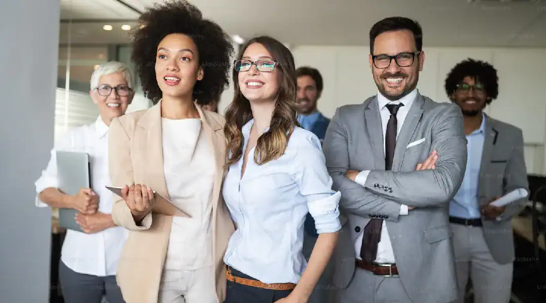 Diverse group of young professionals at a cybersecurity conference, smiling and engaging.