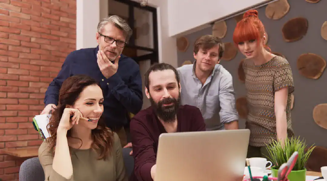 Group of professionals discussing network security and certifications in an office setting.