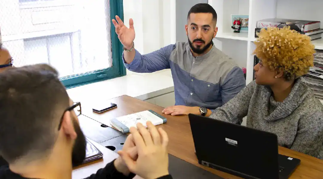Instructor explaining cloud certifications to students in a classroom setting.
