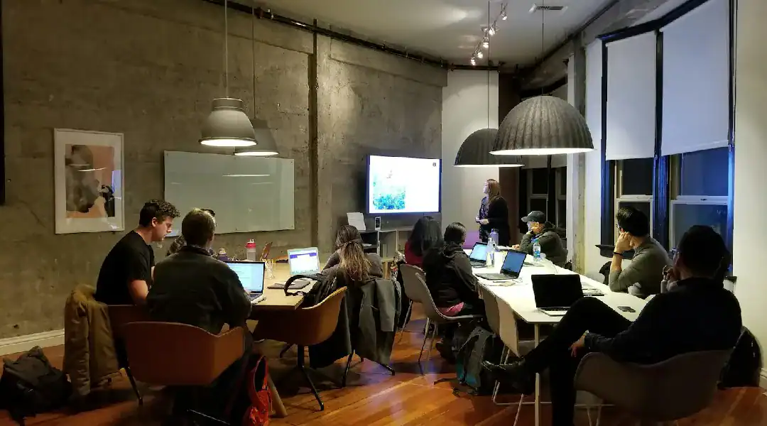 Group training session on Juniper JN0-251 certification in a modern conference room.