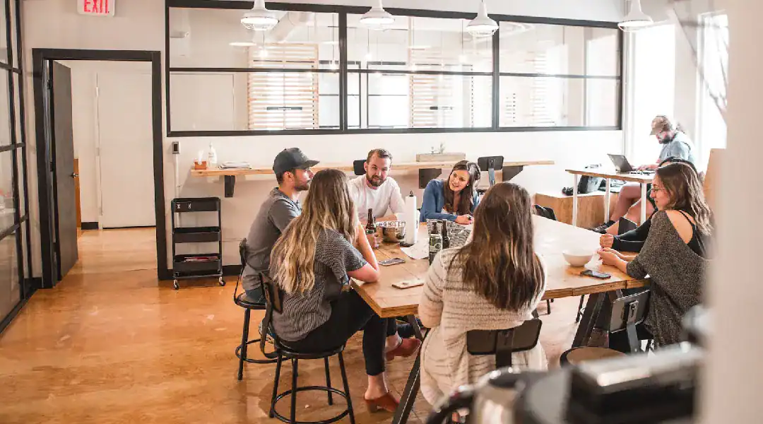 Group of professionals collaborating in a bright office space.