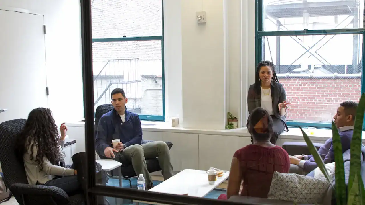 Group of professionals in a meeting discussing network security strategies.