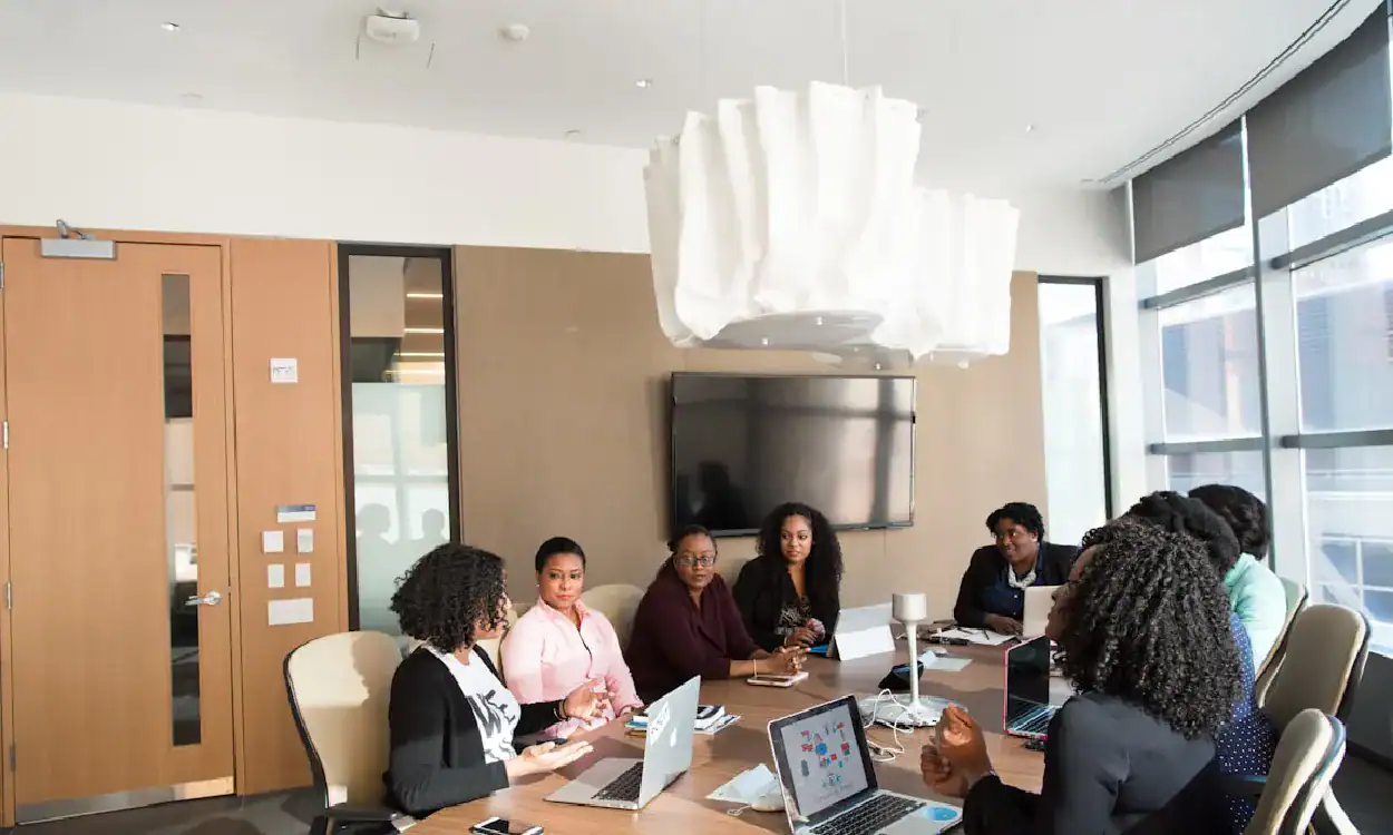 Group of professionals in a modern conference room during a training session.