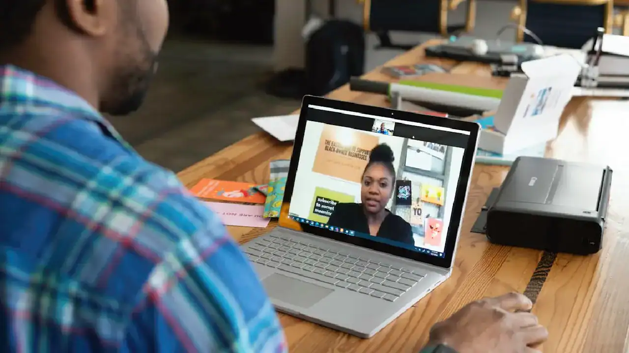 Man attending online Salesforce training session on laptop.